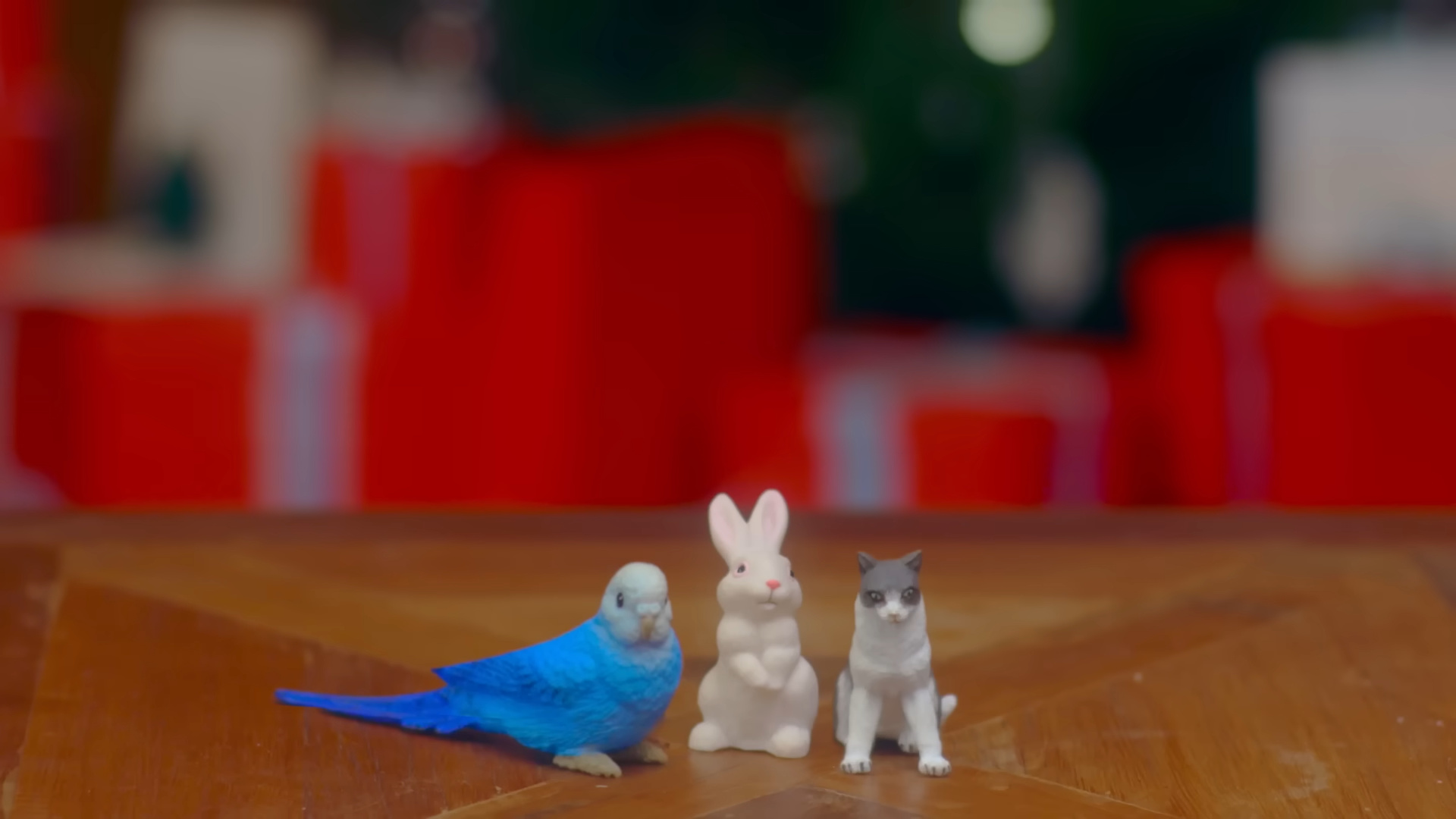 A bird figure, a rabbit figure, and a cat figure.
